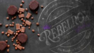 Blurred background image of chocolate pieces and brownies