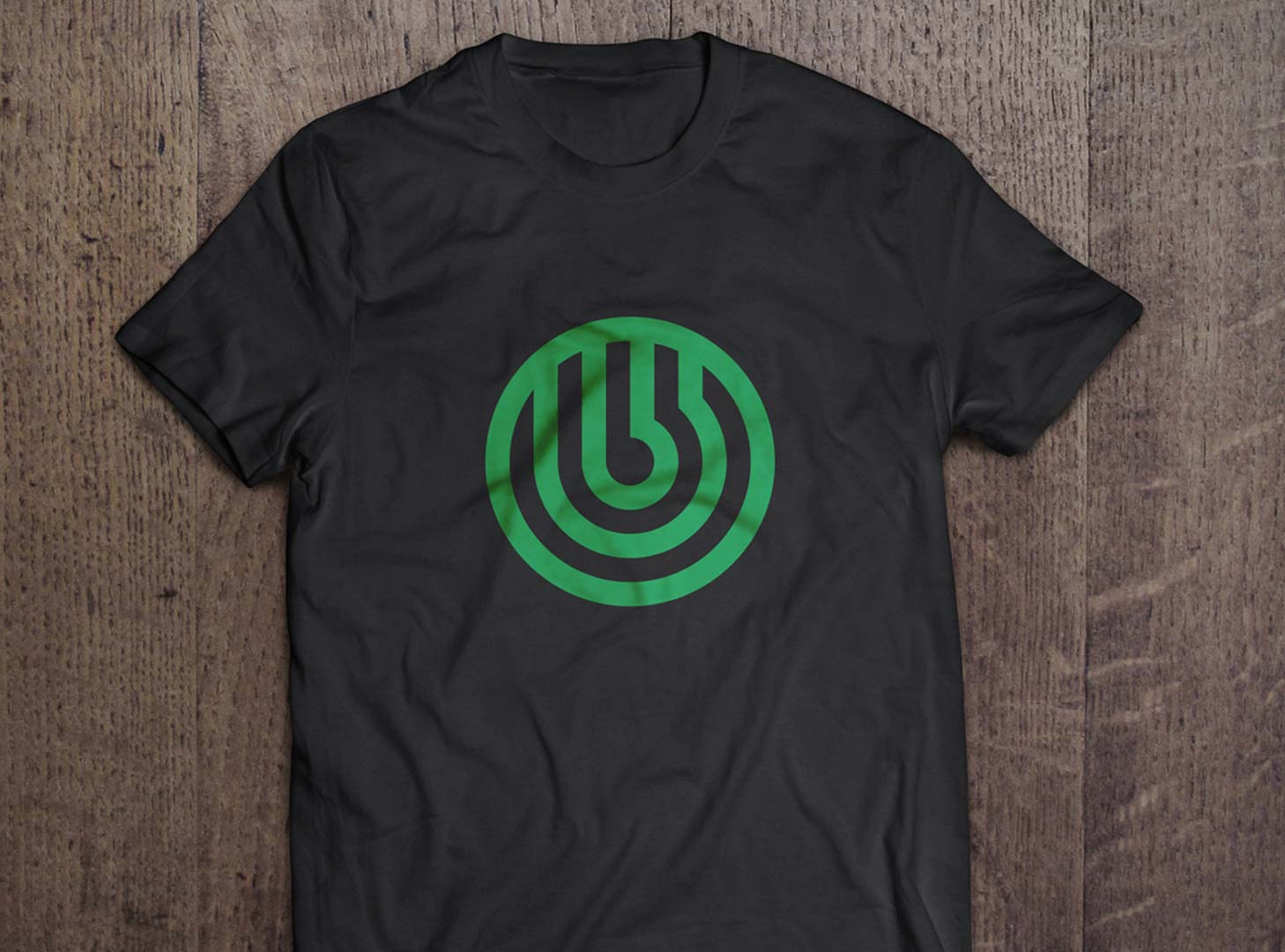 Photo of a black t-shirt demonstrating a technology brand identity refresh example.