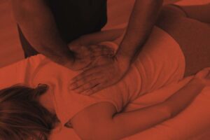 chiropractor massaging a lady